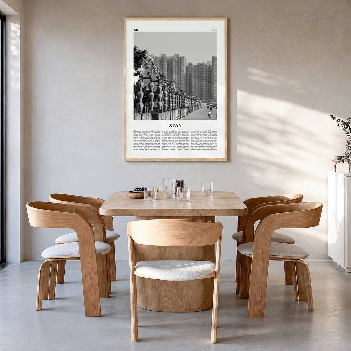 Xi'an Newspaper Poster in a natural wood frame, hanging in a dining room