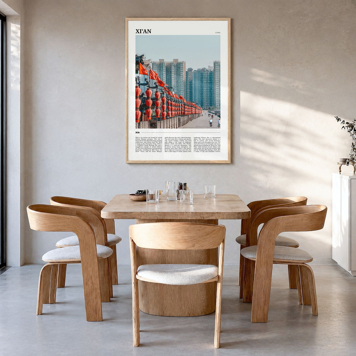 Xi'an Travel Poster in a natural wood frame, hanging in a dining room