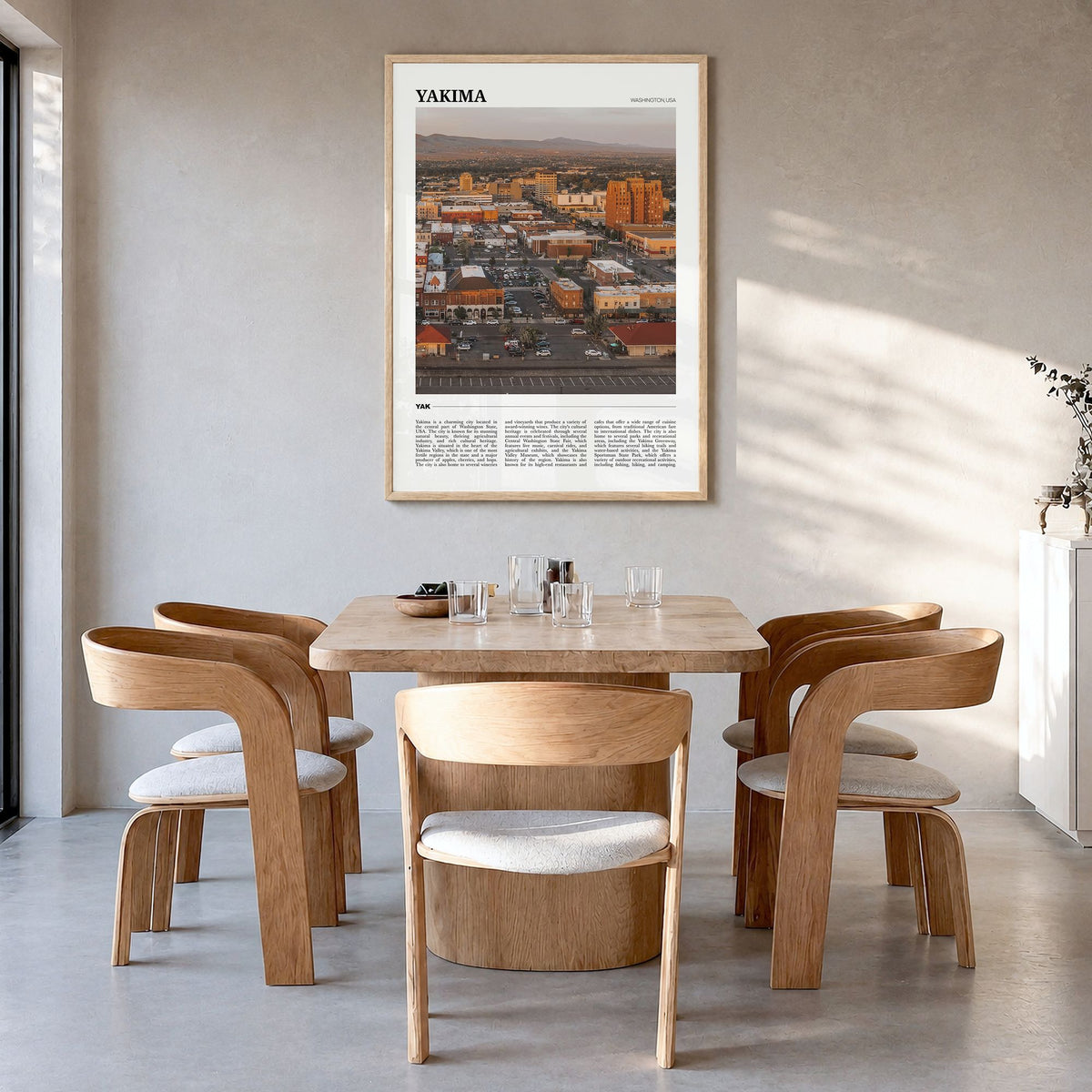 Yakima Travel Poster in a natural wood frame, hanging in a dining room