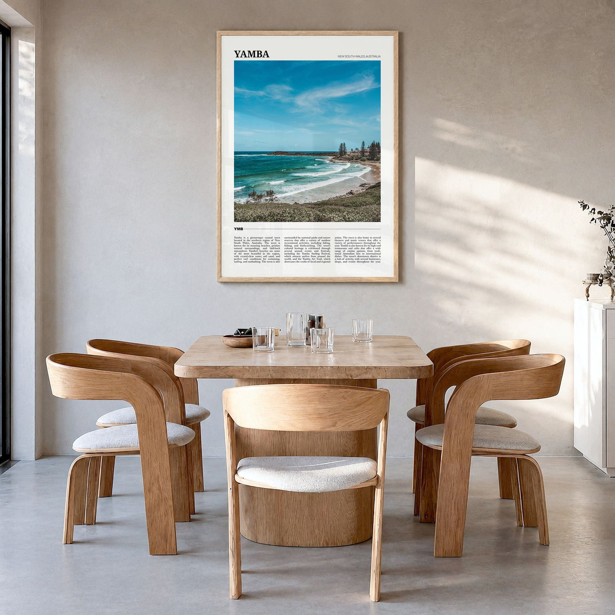 Yamba Travel Poster in a natural wood frame, hanging in a dining room
