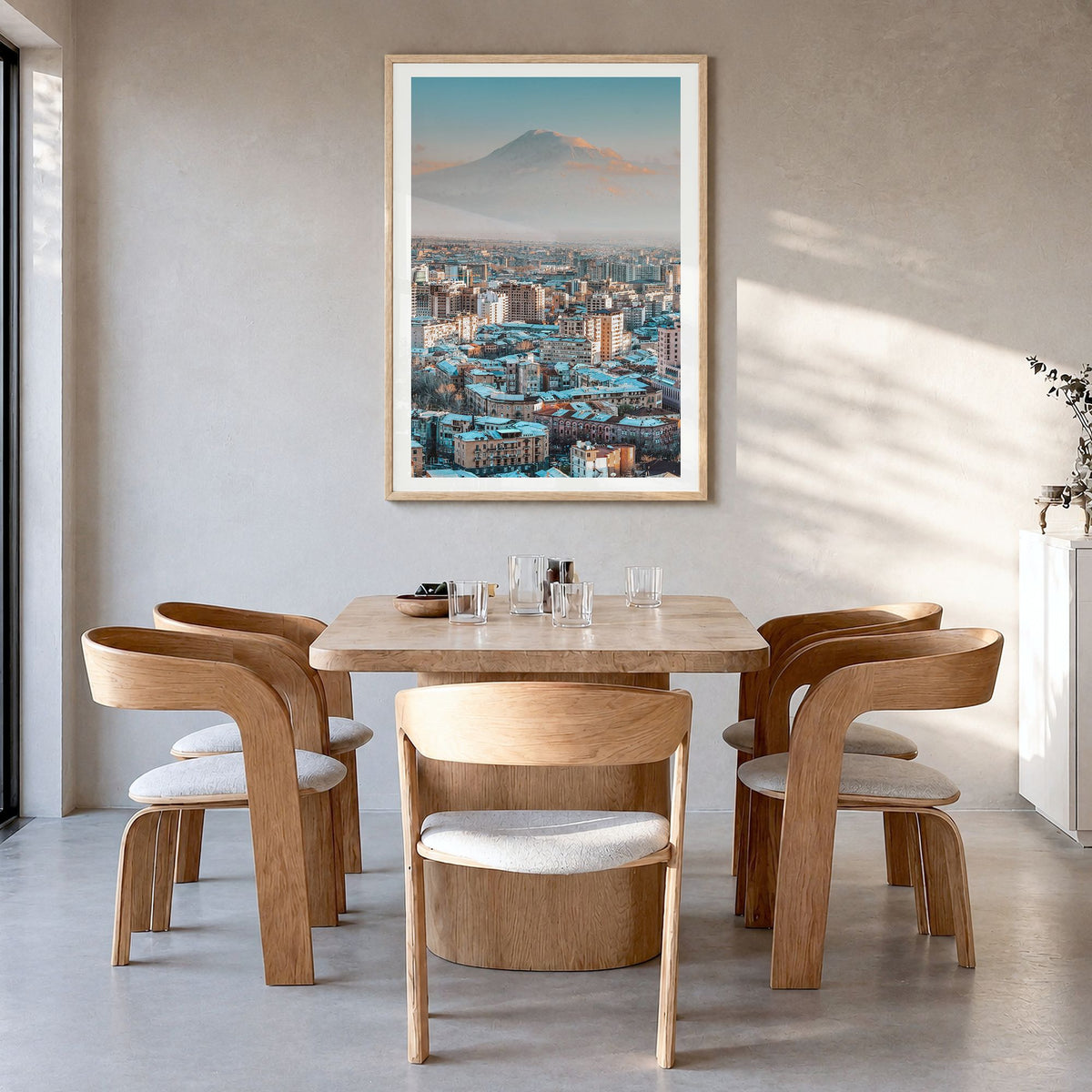 Yerevan Photo Poster in a natural wood frame, hanging in a dining room, white border
