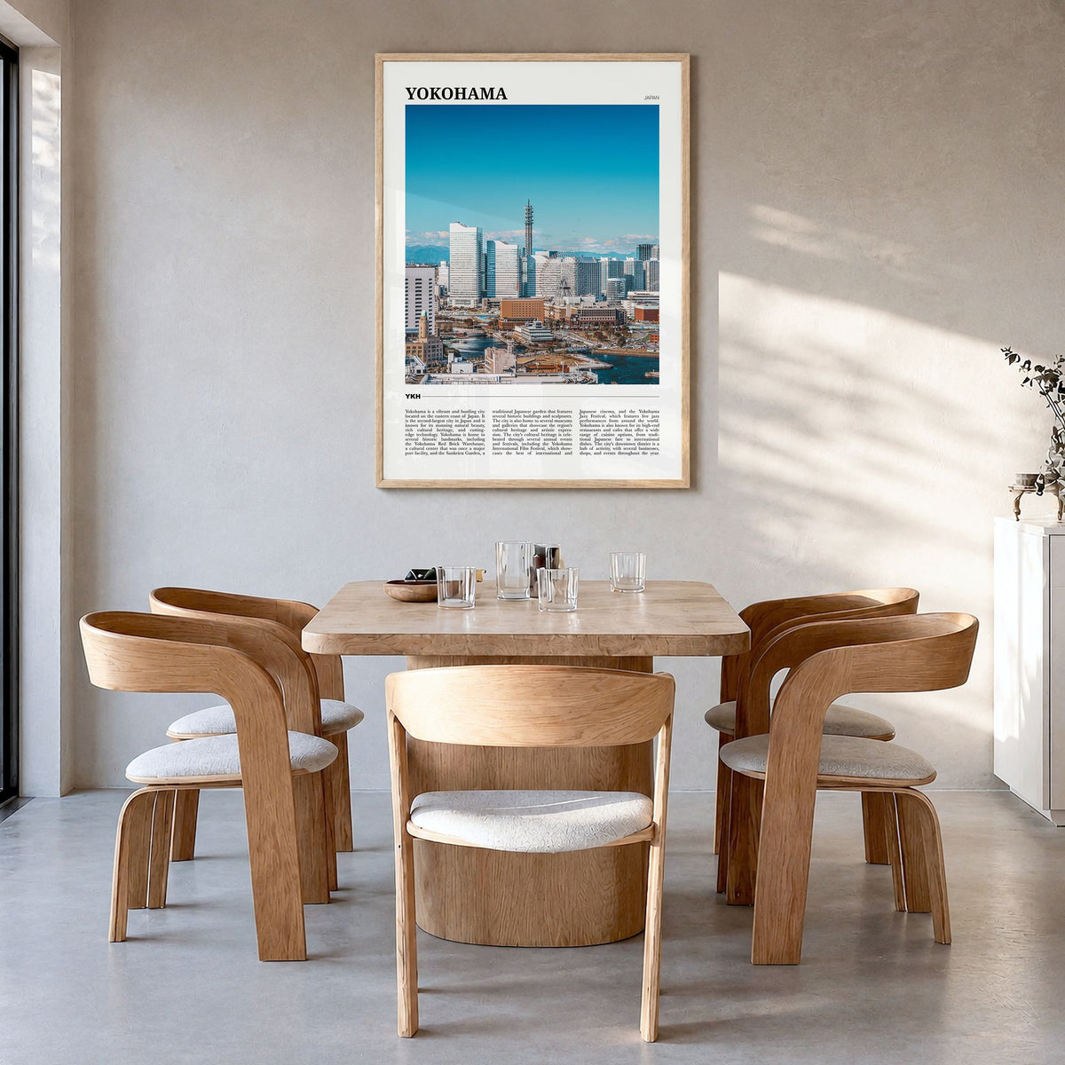 Yokohama Travel Poster in a natural wood frame, hanging in a dining room
