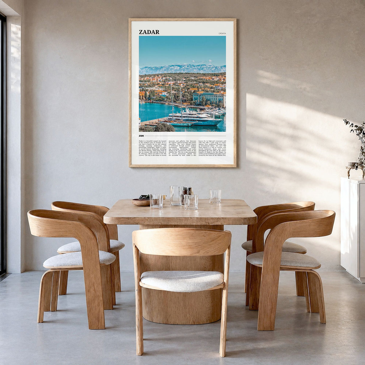 Zadar Travel Poster in a natural wood frame, hanging in a dining room