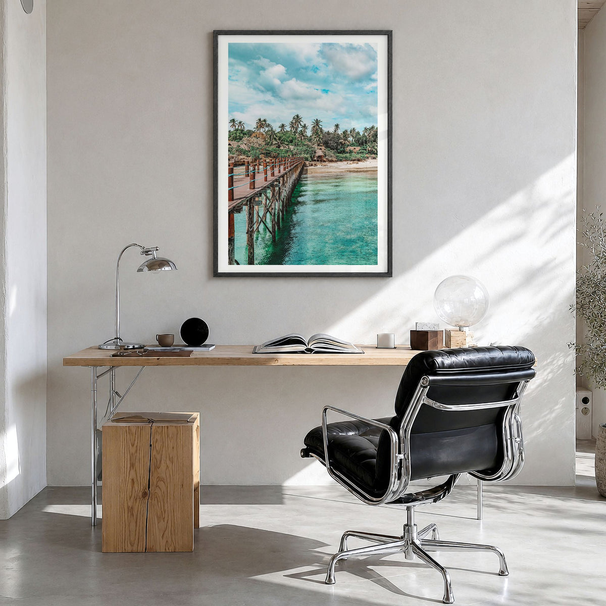 Zanzibar Photo Poster in a black wood frame, hanging in a bright home office, white border