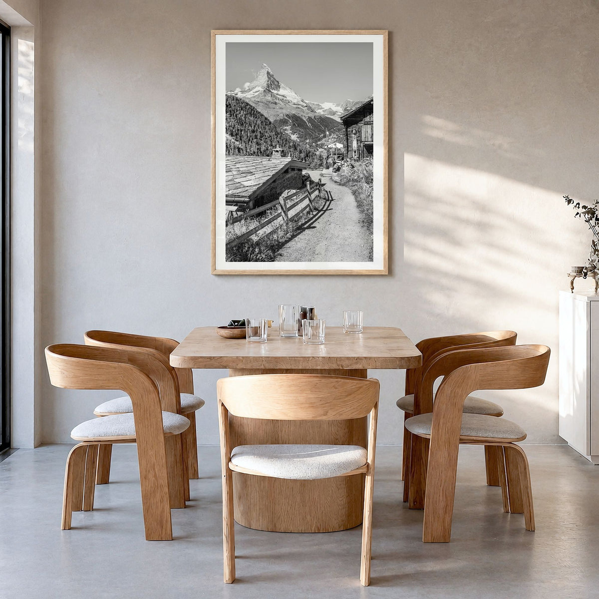 Zermatt Photo Poster in a natural wood frame, hanging in a dining room, white border