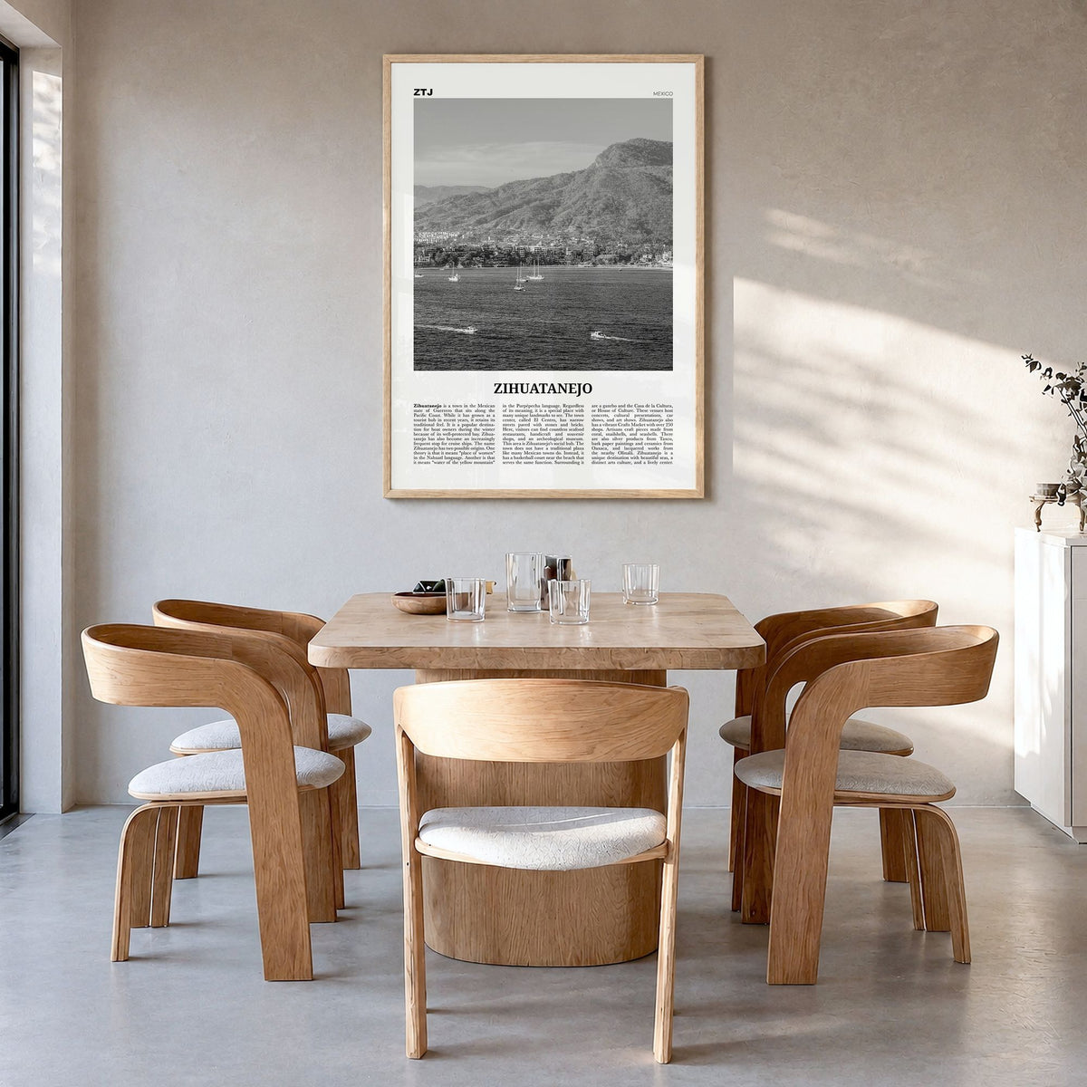 Zihuatanejo Newspaper Poster in a natural wood frame, hanging in a dining room