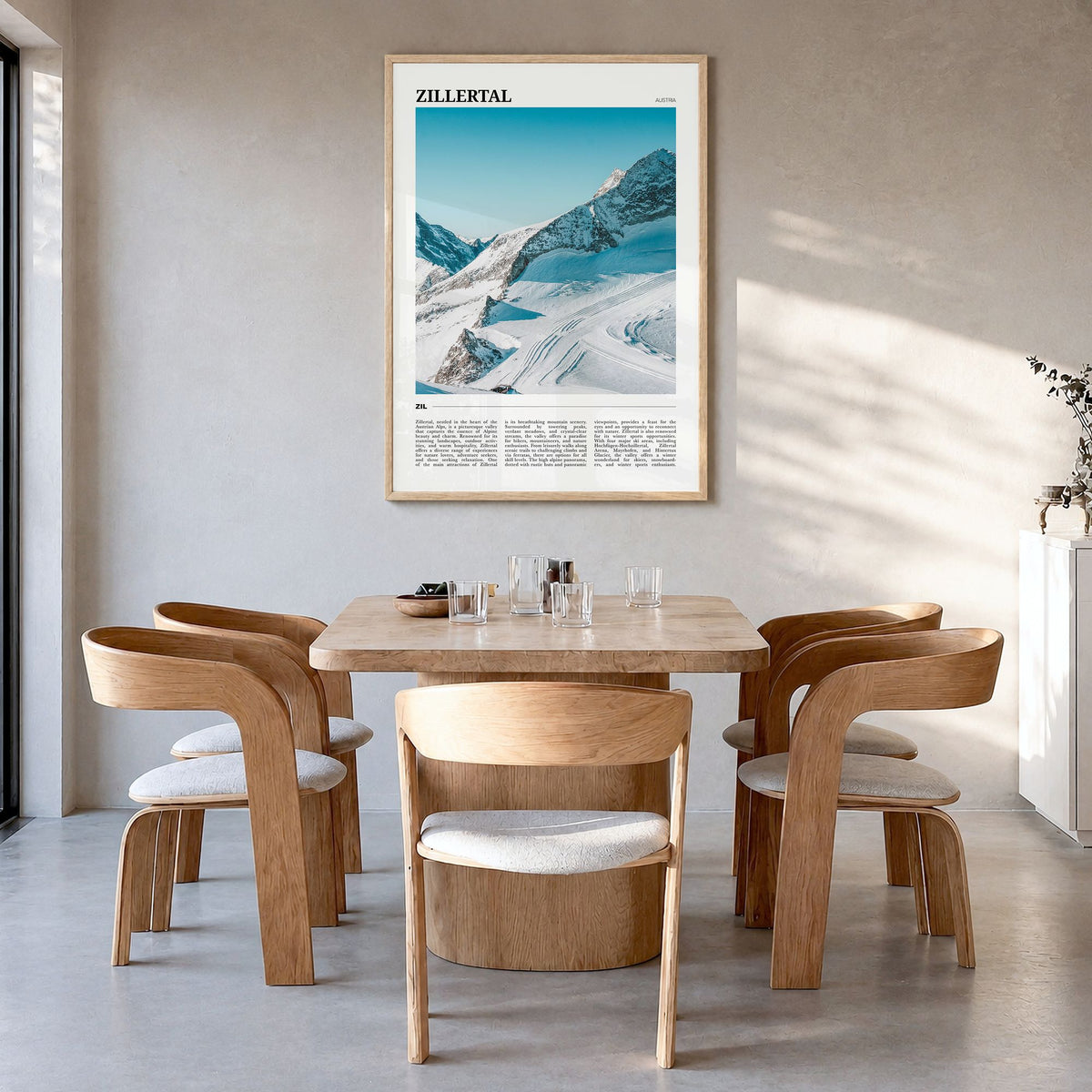Zillertal Travel Poster in a natural wood frame, hanging in a dining room
