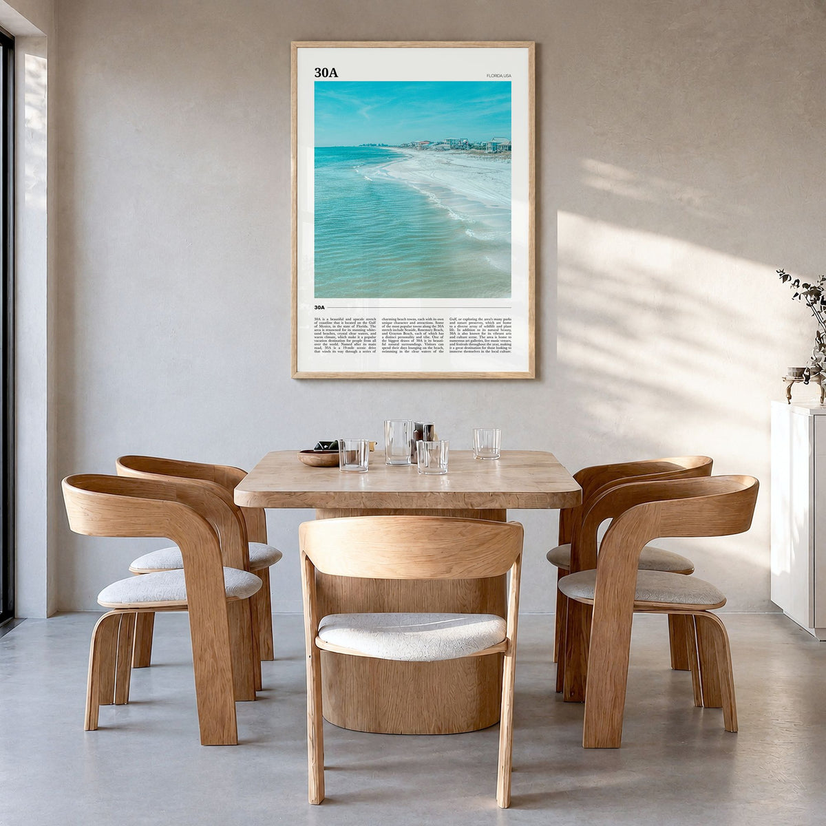 30A Travel Poster in a natural wood frame, hanging in a dining room