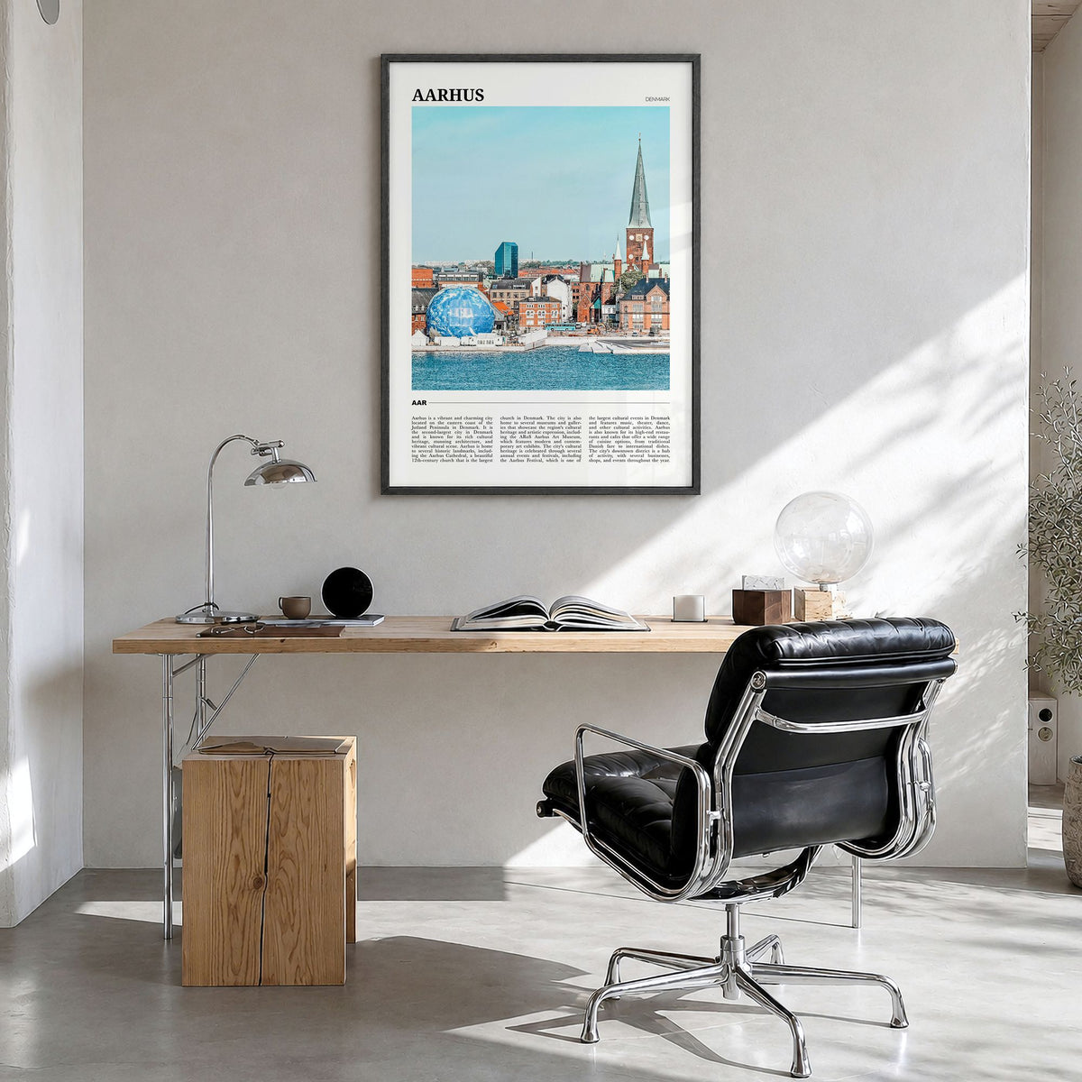 Aarhus Travel Poster in a black wood frame, hanging in a bright home office