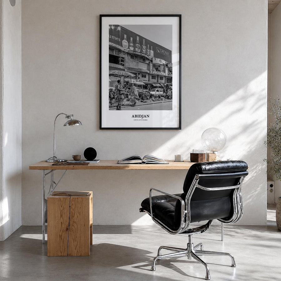 Abidjan black & white classic poster of Côte d'Ivoire – vertical wall art in black wood frame, hanging on wall