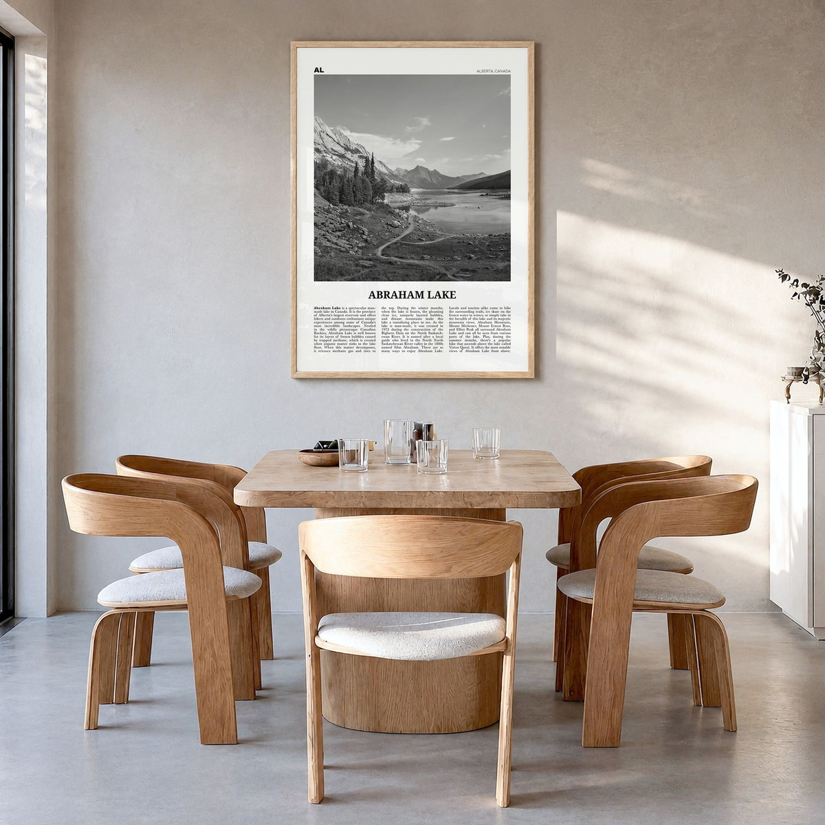 Abraham Lake Newspaper Poster in a natural wood frame, hanging in a dining room