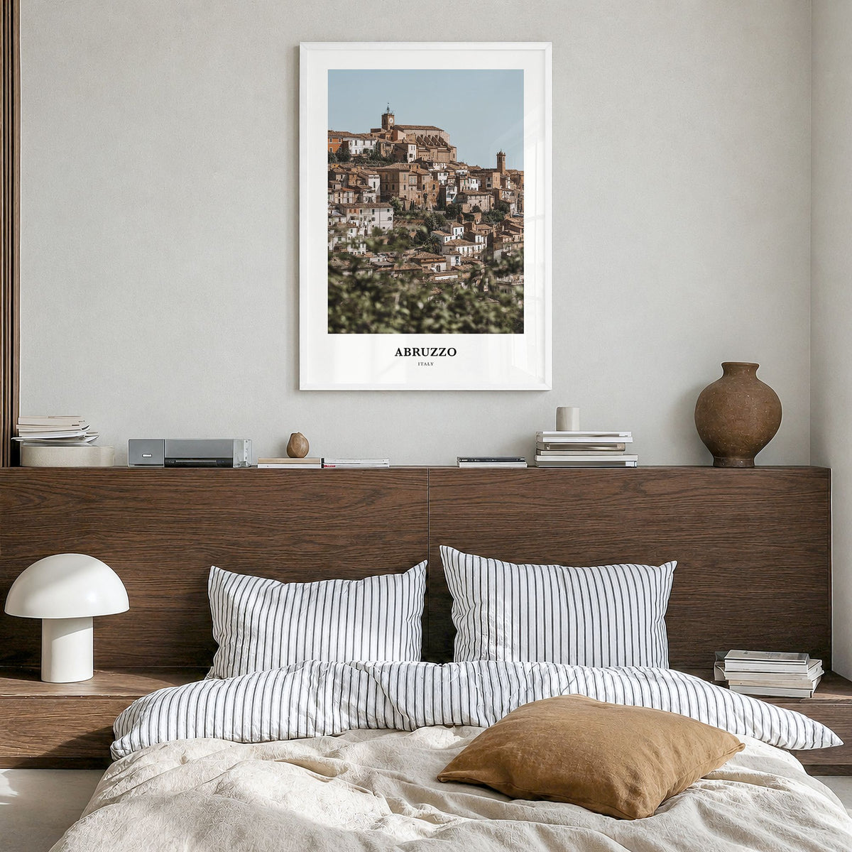 Abruzzo Classic No 1 Poster in a white wood frame, hanging in a bedroom