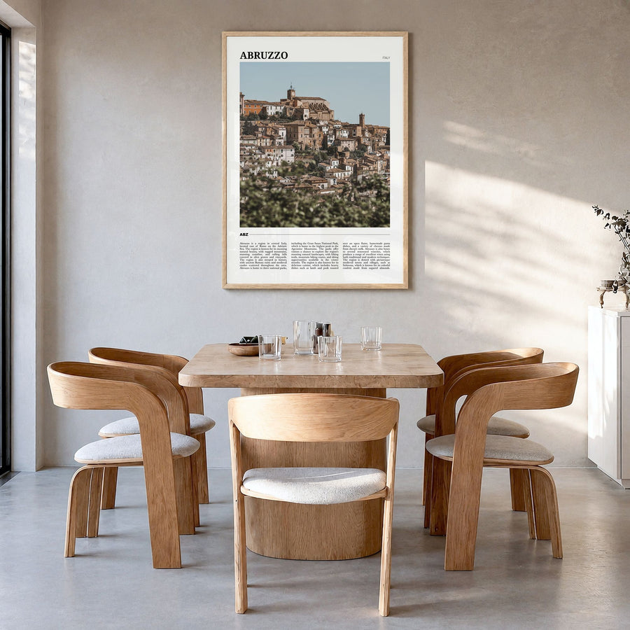 Abruzzo Travel No 1 Poster in a natural wood frame, hanging in a dining room