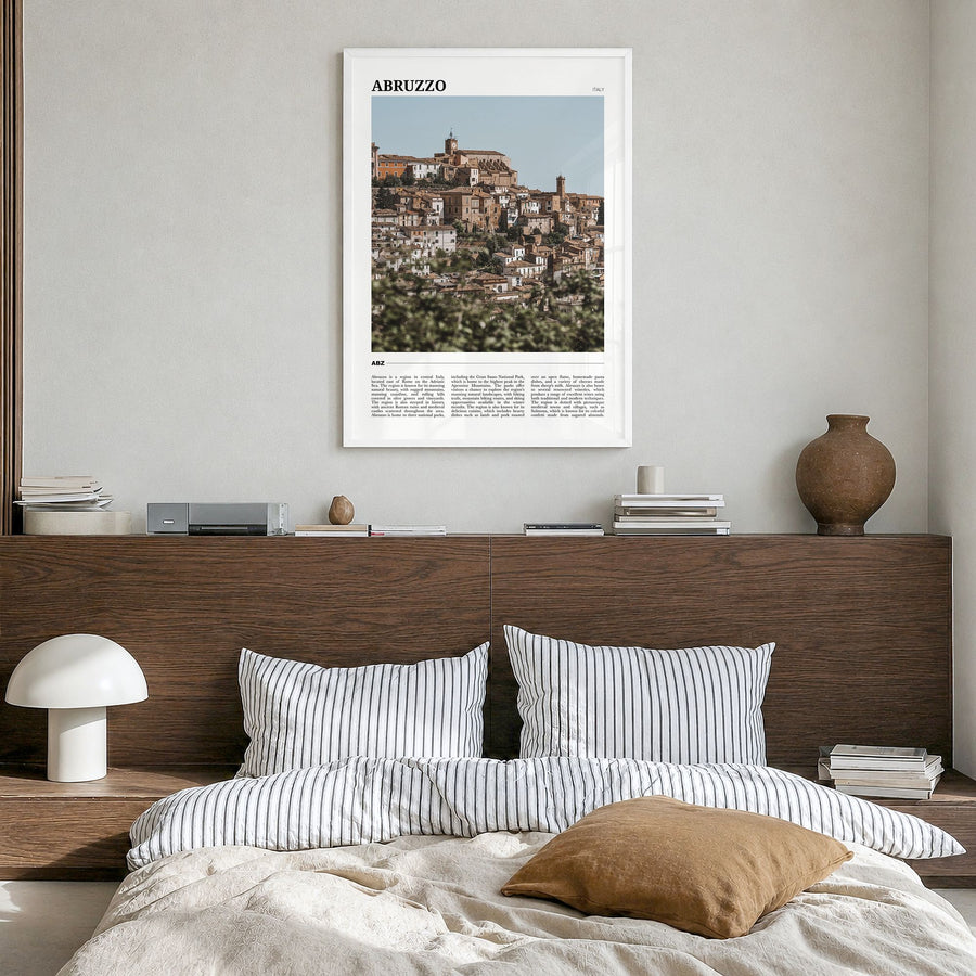 Abruzzo Travel No 1 Poster in a white wood frame, hanging in a bedroom