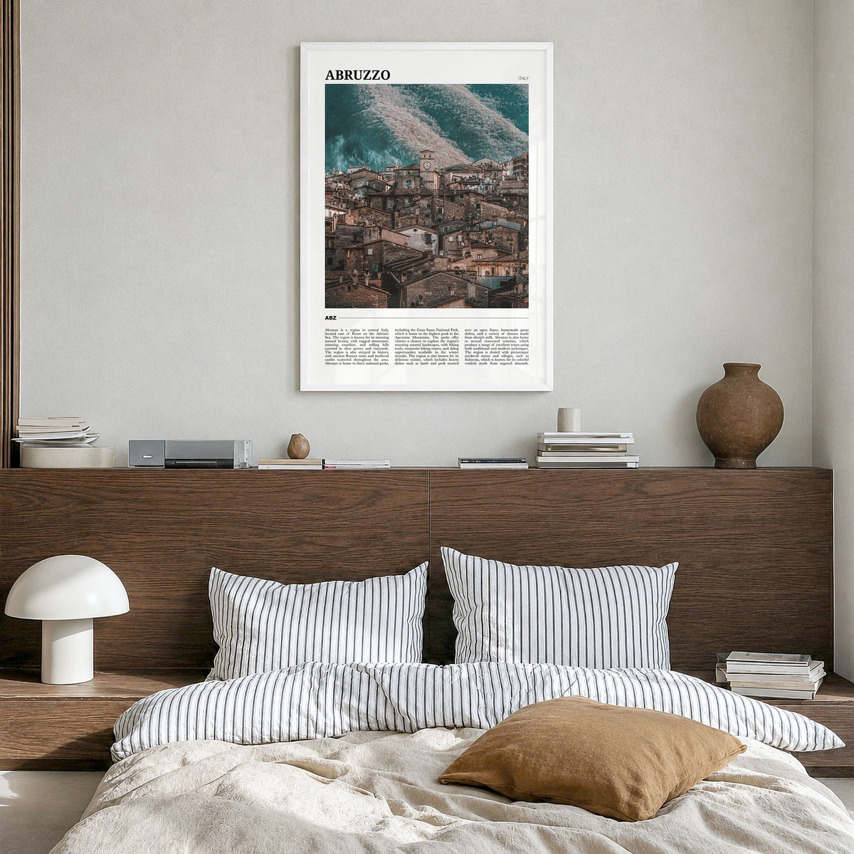 Abruzzo Travel No 3 Poster in a white wood frame, hanging in a bedroom