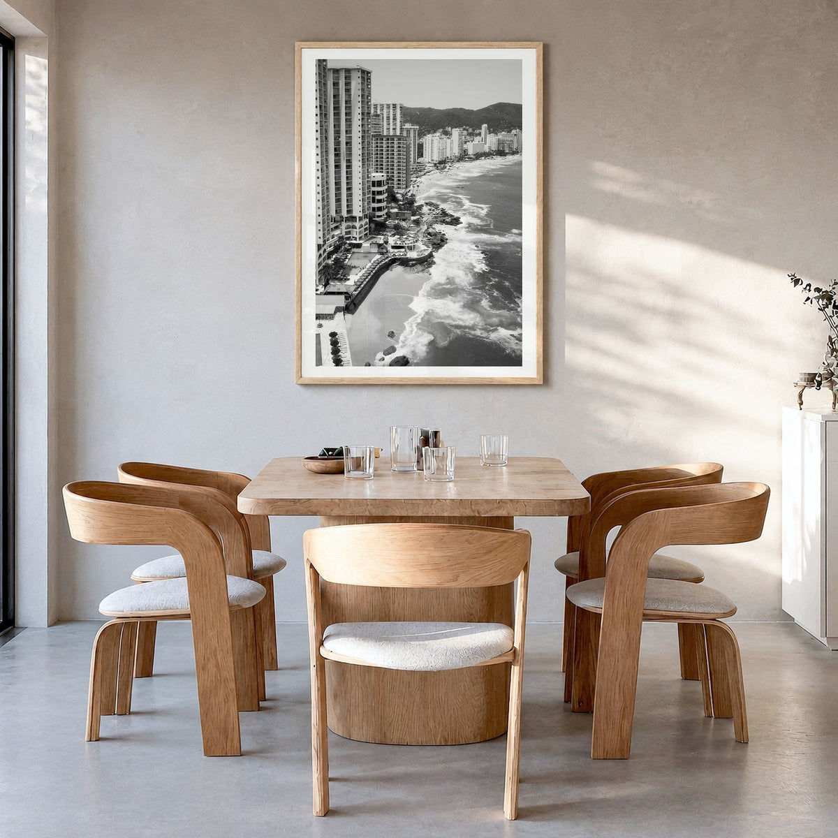 Acapulco Photo Poster in a natural wood frame, hanging in a dining room, white border