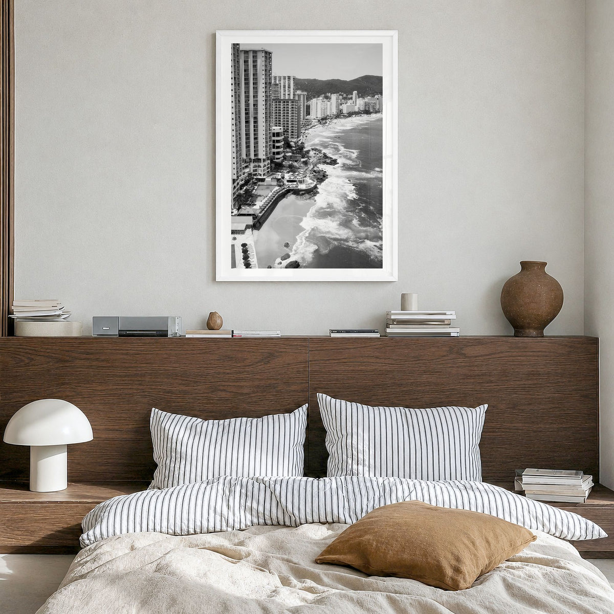 Acapulco Photo Poster in a white wood frame, hanging in a bedroom, white border