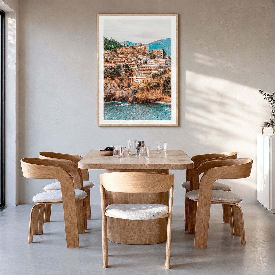 Acapulco Photo Poster in a natural wood frame, hanging in a dining room, white border
