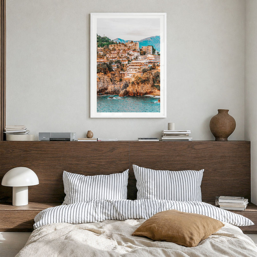 Acapulco Photo Poster in a white wood frame, hanging in a bedroom, white border