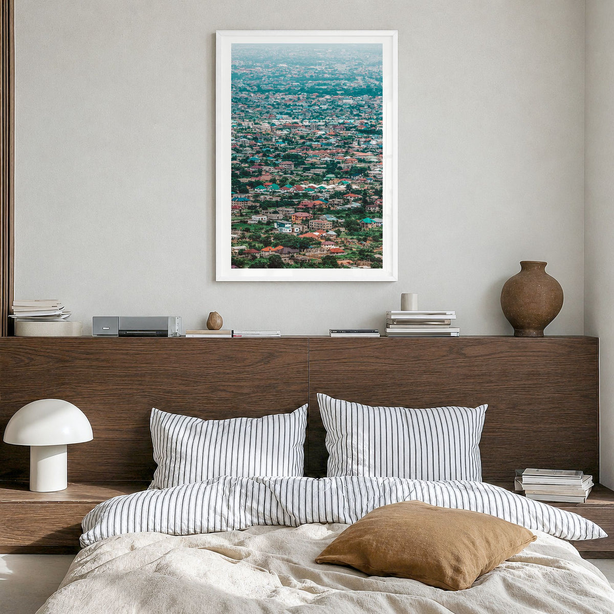 Accra Photo Poster in a white wood frame, hanging in a bedroom, white border