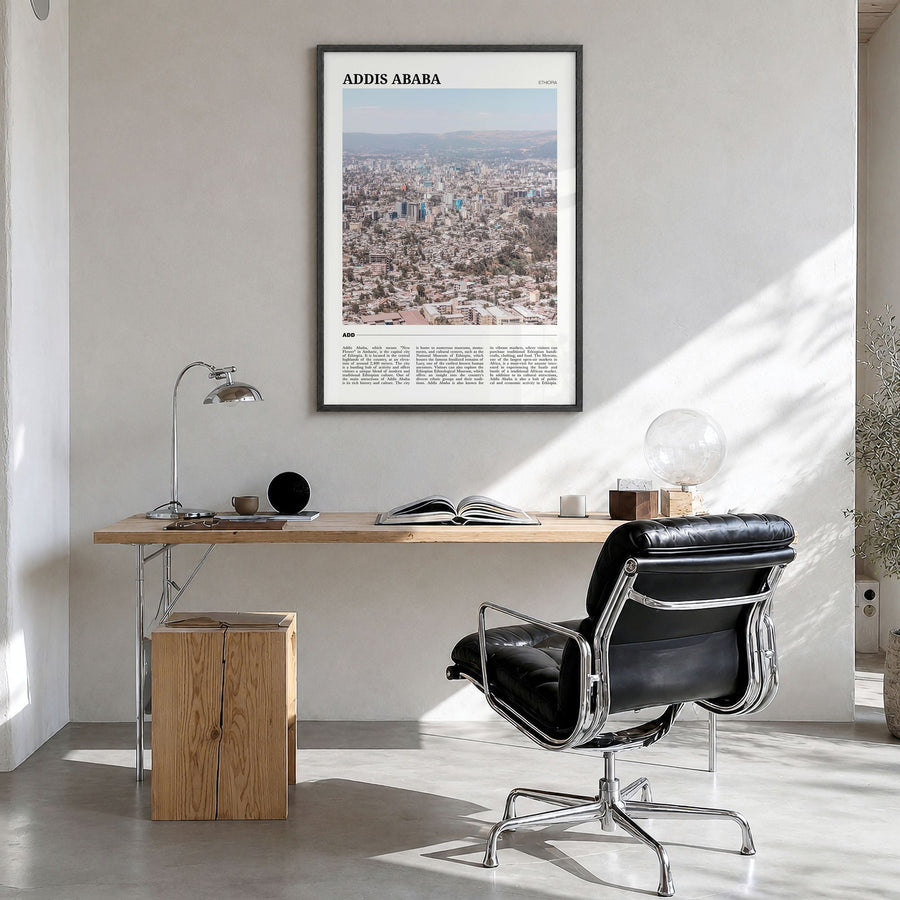 Addis Ababa Travel Poster in a black wood frame, hanging in a bright home office