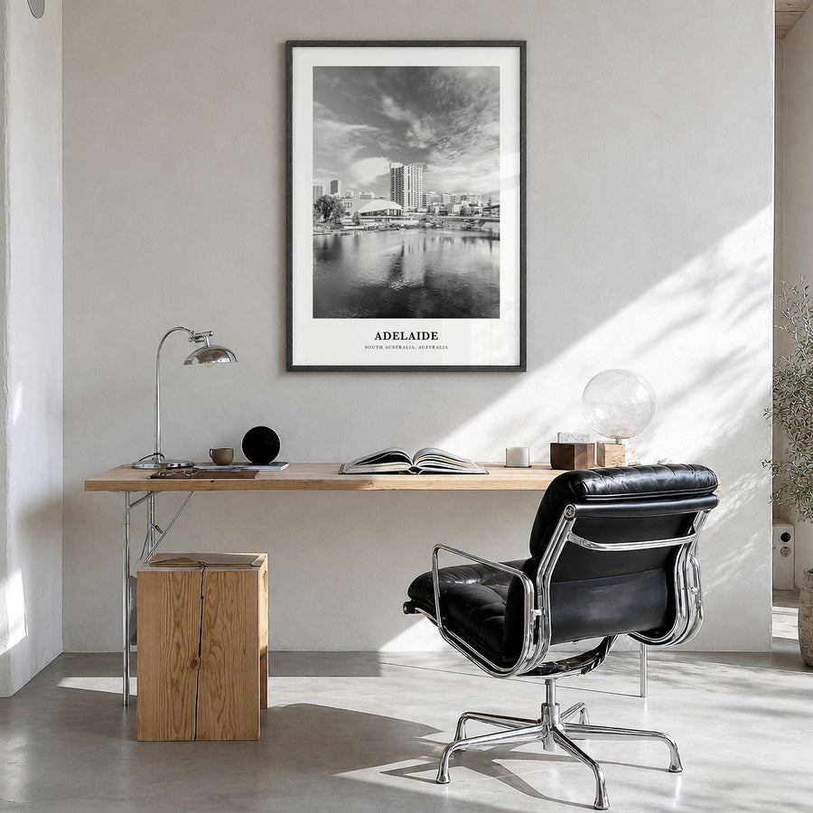 Adelaide Classic Poster in a black wood frame, hanging in a bright home office