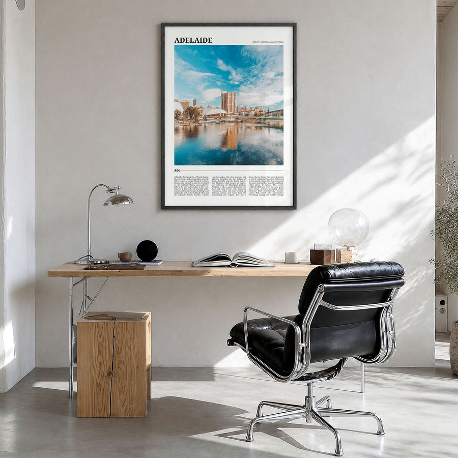 Adelaide Travel Poster in a black wood frame, hanging in a bright home office