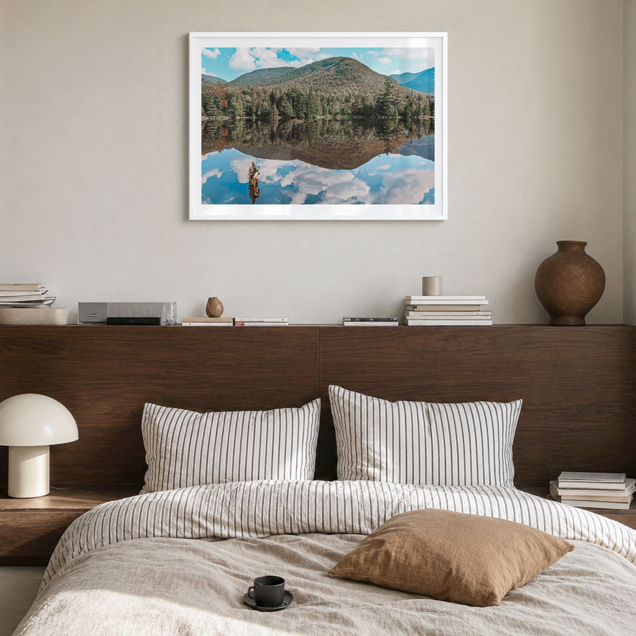 Adirondack Mountains Photo Poster in a white wood frame, hanging in a bedroom, white border