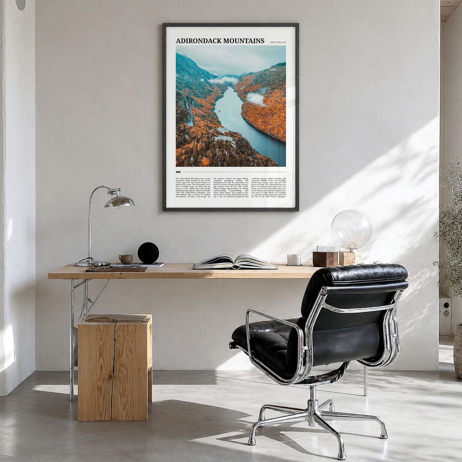 Adirondack Mountains Travel Poster in a black wood frame, hanging in a bright home office