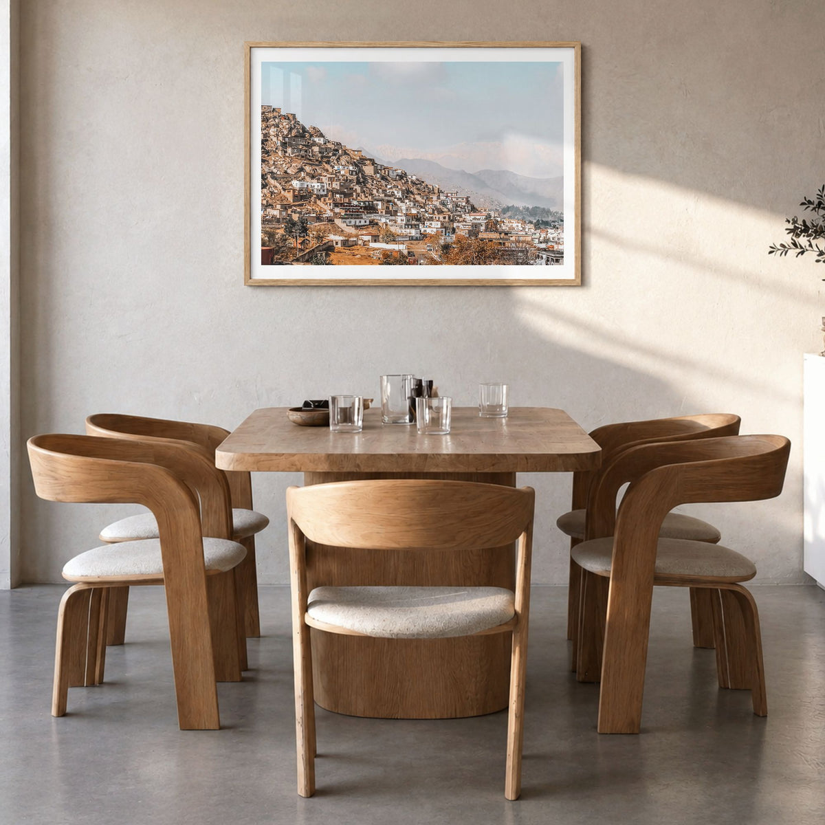 Afghanistan Photo Poster in a natural wood frame, hanging in a dining room, white border