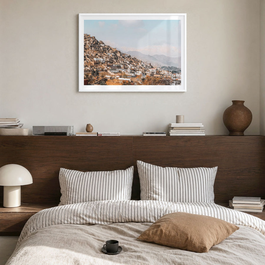 Afghanistan Photo Poster in a white wood frame, hanging in a bedroom, white border