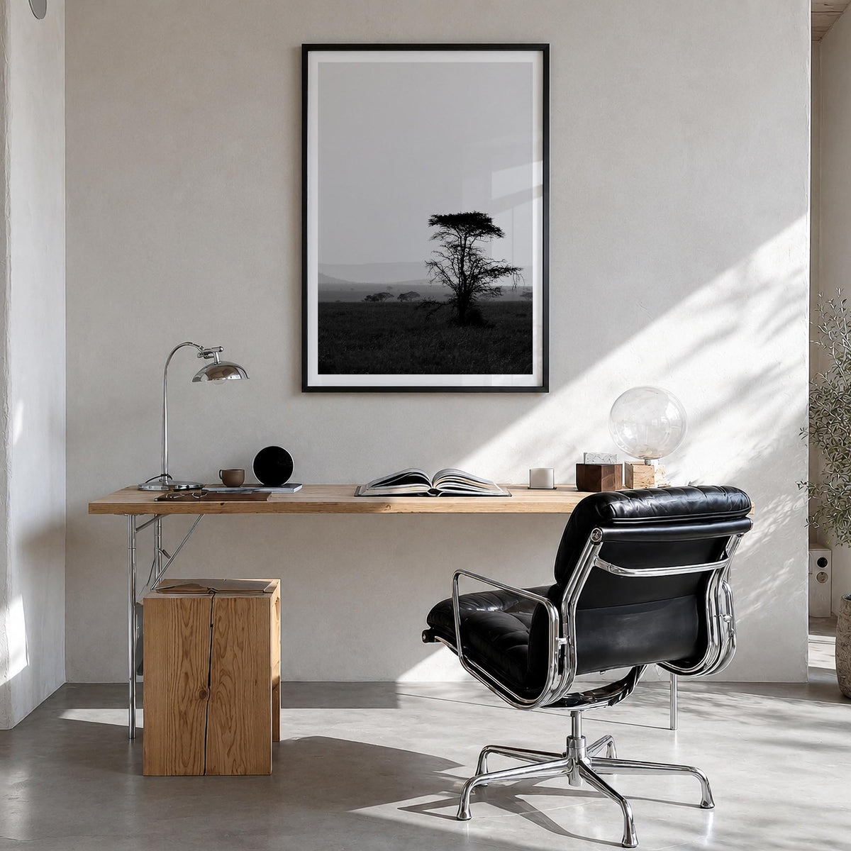 Africa black & white photo poster of World – vertical wall art in black wood frame with white border, hanging on wall