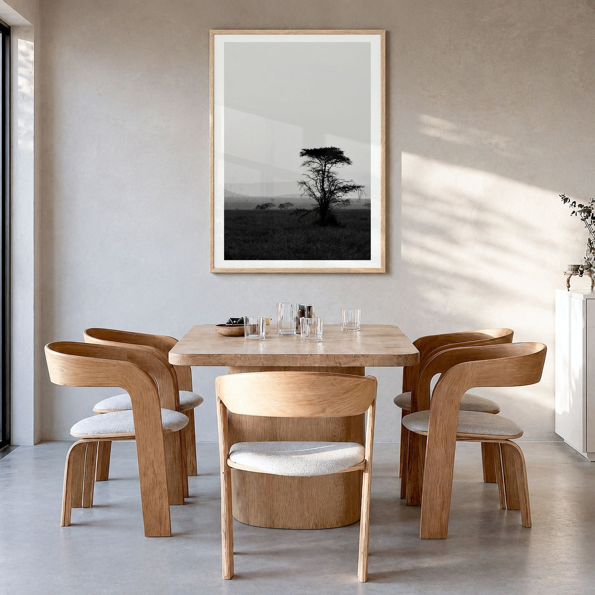 Africa Photo Poster in a natural wood frame, hanging in a dining room, white border