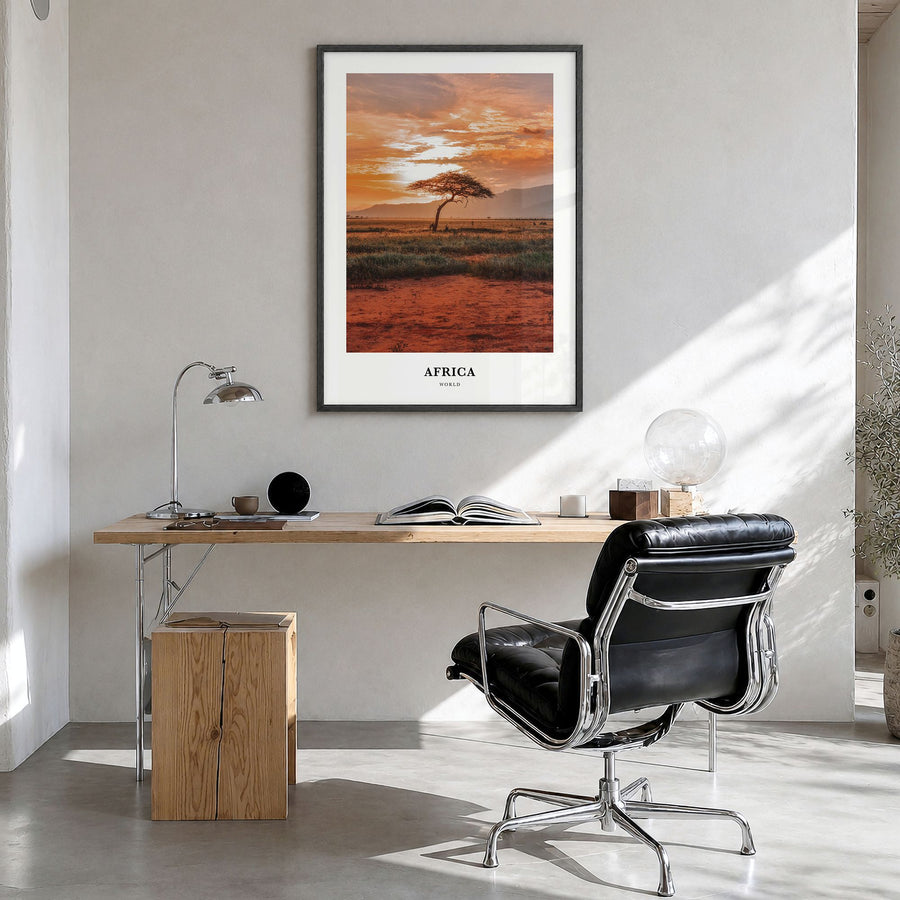 Africa Classic Poster in a black wood frame, hanging in a bright home office
