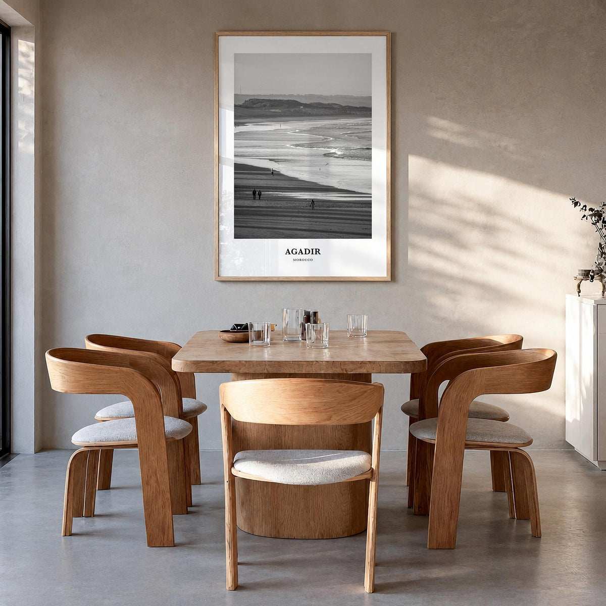 Agadir black & white classic poster of Morocco – vertical wall art in natural wood frame, hanging on wall