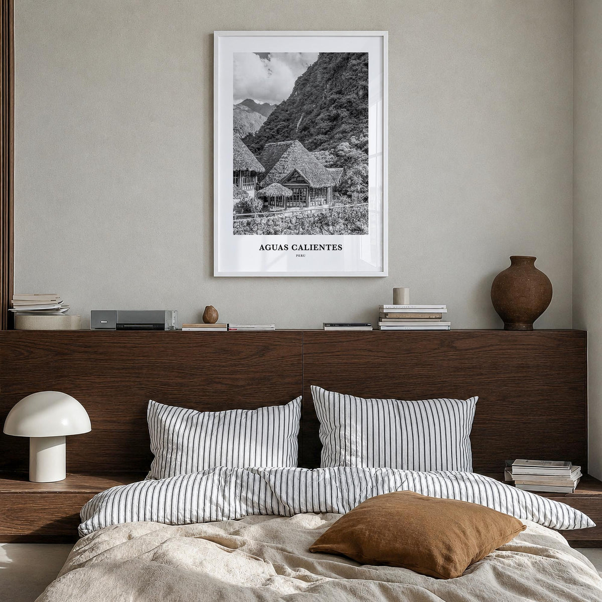 Aguas Calientes black & white classic poster of Peru – vertical wall art in white wood frame, hanging on wall