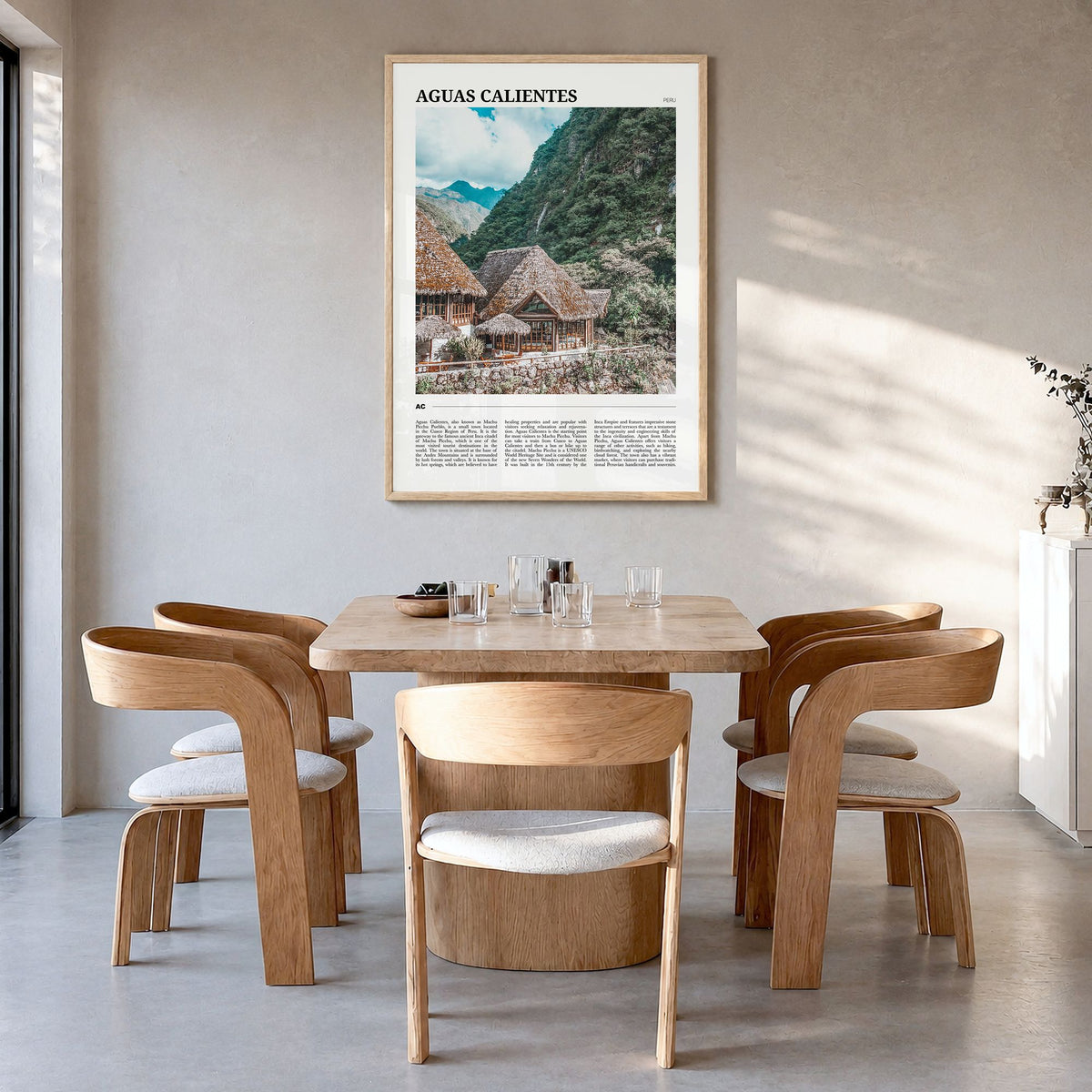 Aguas Calientes, Peru Travel Poster in a natural wood frame, hanging in a dining room