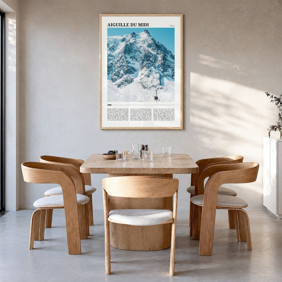 Aiguille du Midi Travel Poster in a natural wood frame, hanging in a dining room