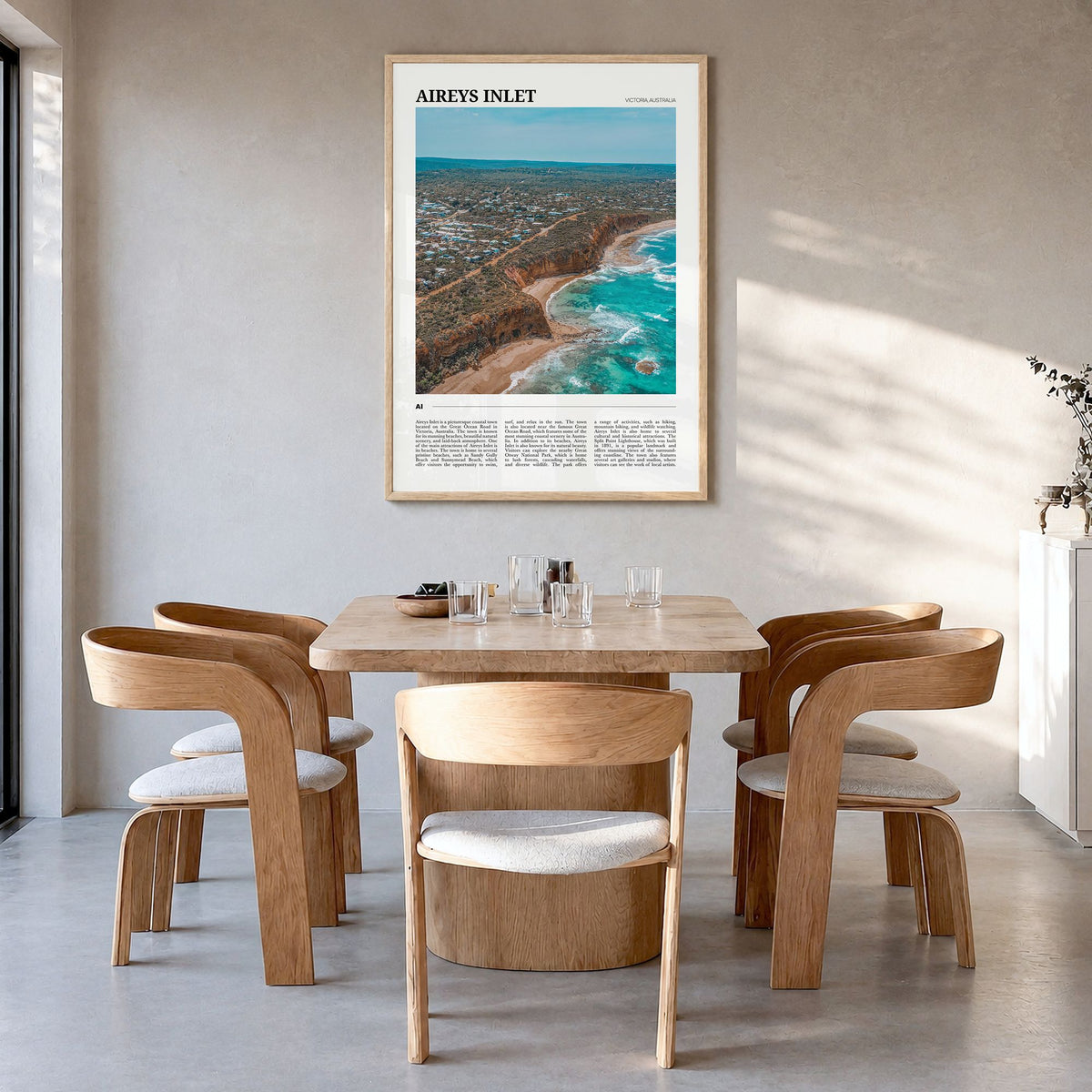 Aireys Inlet Travel Poster in a natural wood frame, hanging in a dining room