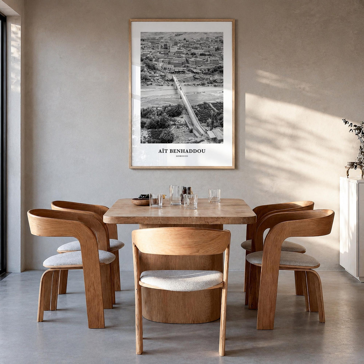 Aït Benhaddou black & white classic poster of Morocco – vertical wall art in natural wood frame, hanging on wall