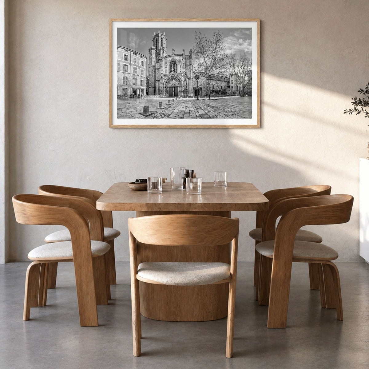 Aix-en-Provence Photo Poster in a natural wood frame, hanging in a dining room, white border