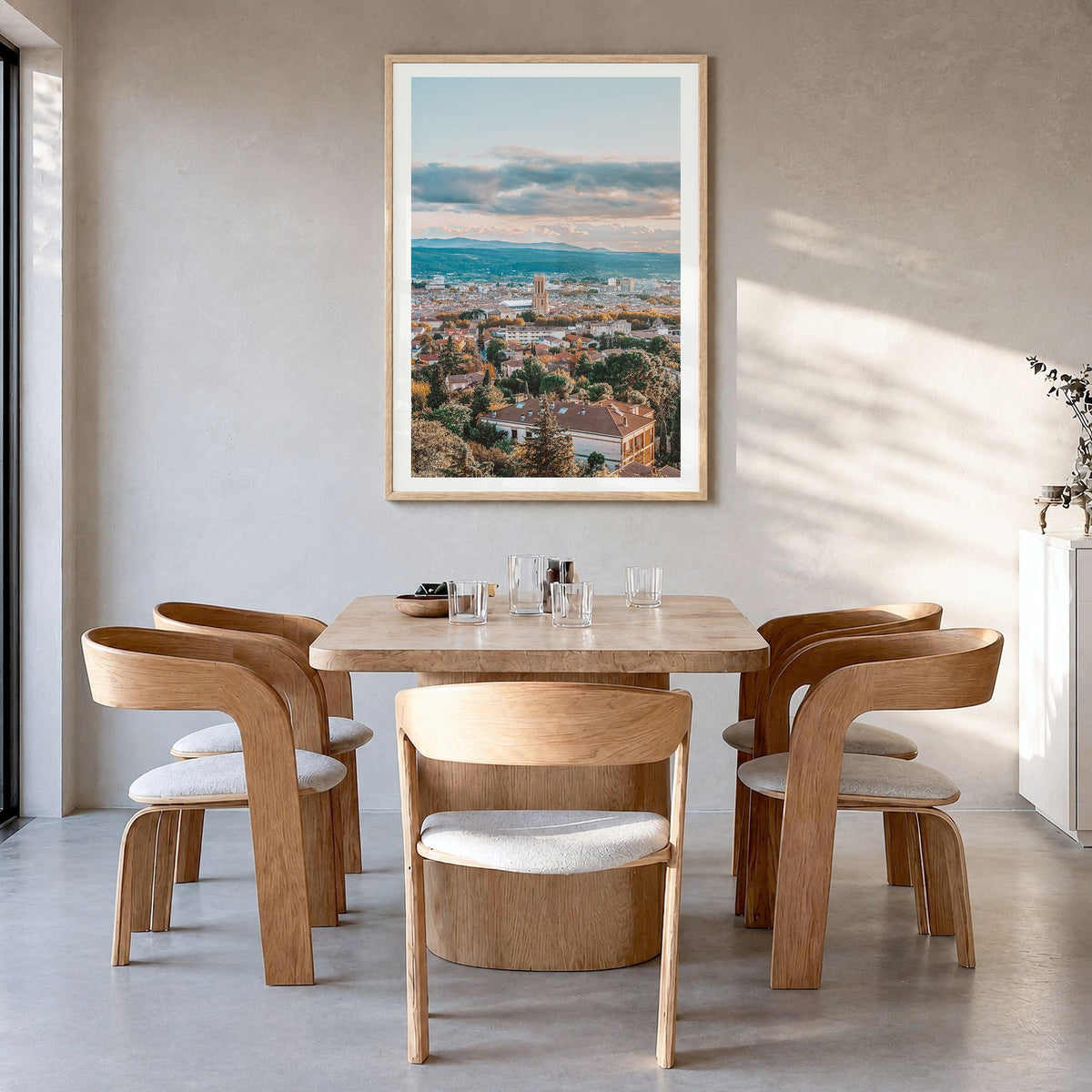 Aix-en-Provence Photo Poster in a natural wood frame, hanging in a dining room, white border
