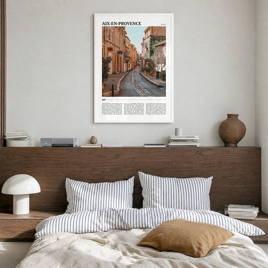 Aix-en-Provence Travel Poster in a white wood frame, hanging in a bedroom
