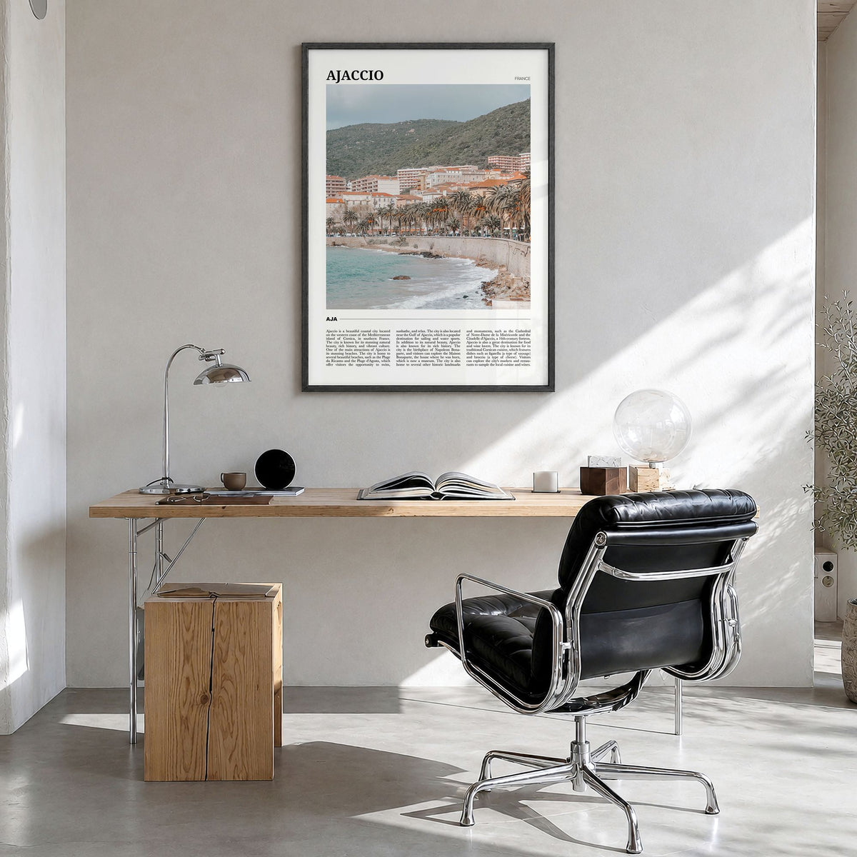 Ajaccio Travel Poster in a black wood frame, hanging in a bright home office
