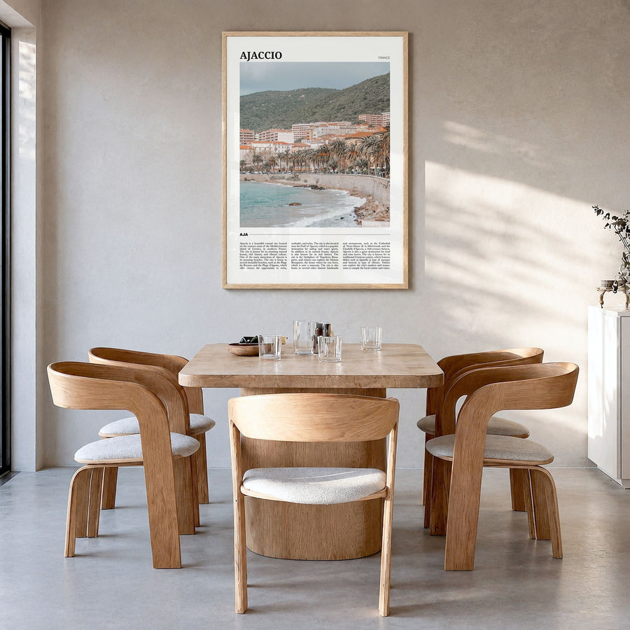 Ajaccio Travel Poster in a natural wood frame, hanging in a dining room