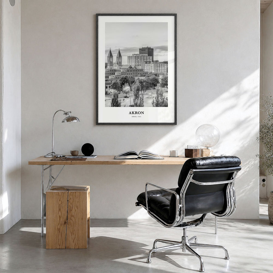 Akron Classic Poster in a black wood frame, hanging in a bright home office