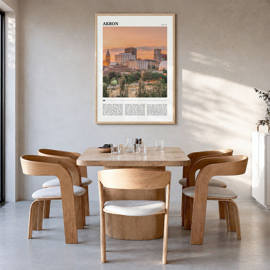 Akron Travel Poster in a natural wood frame, hanging in a dining room
