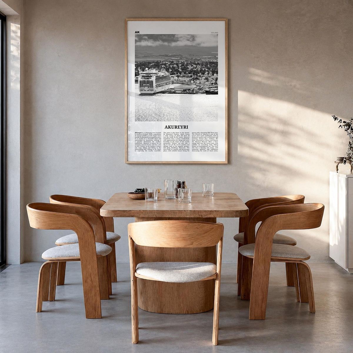 Akureyri black & white newspaper poster of Iceland – vertical wall art in natural wood frame, hanging on wall
