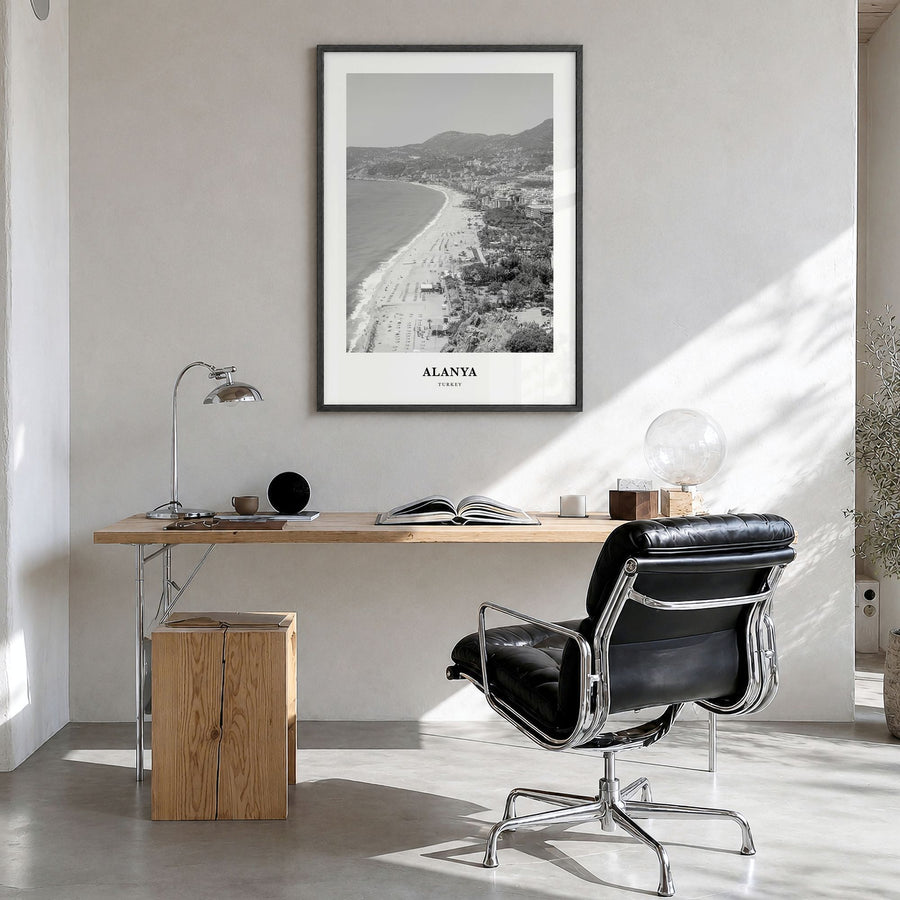 Alanya Classic Poster in a black wood frame, hanging in a bright home office
