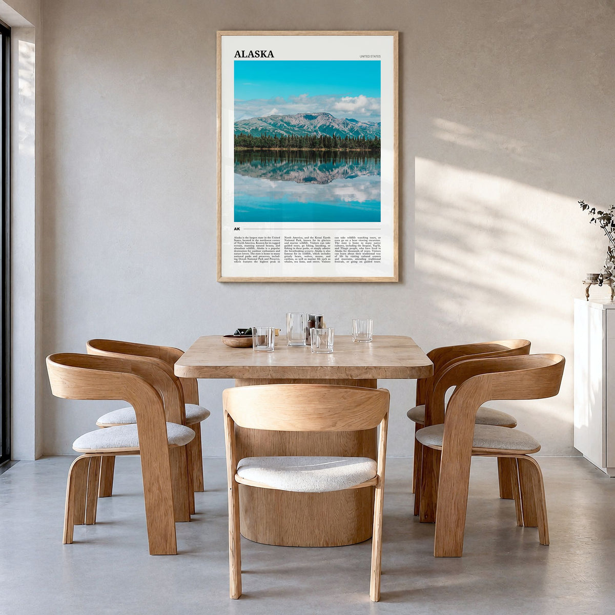 Alaska Travel No 1 Poster in a natural wood frame, hanging in a dining room